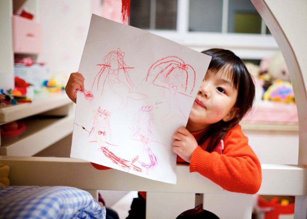 child painting and experiencing and expressing new things - Treehouse Early Learning Marsden Qld